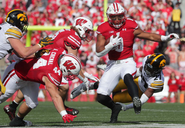 Wisconsin running back Braelon Allen breaking a tackle against Iowa.